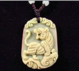 handcarved jade tiger pendant